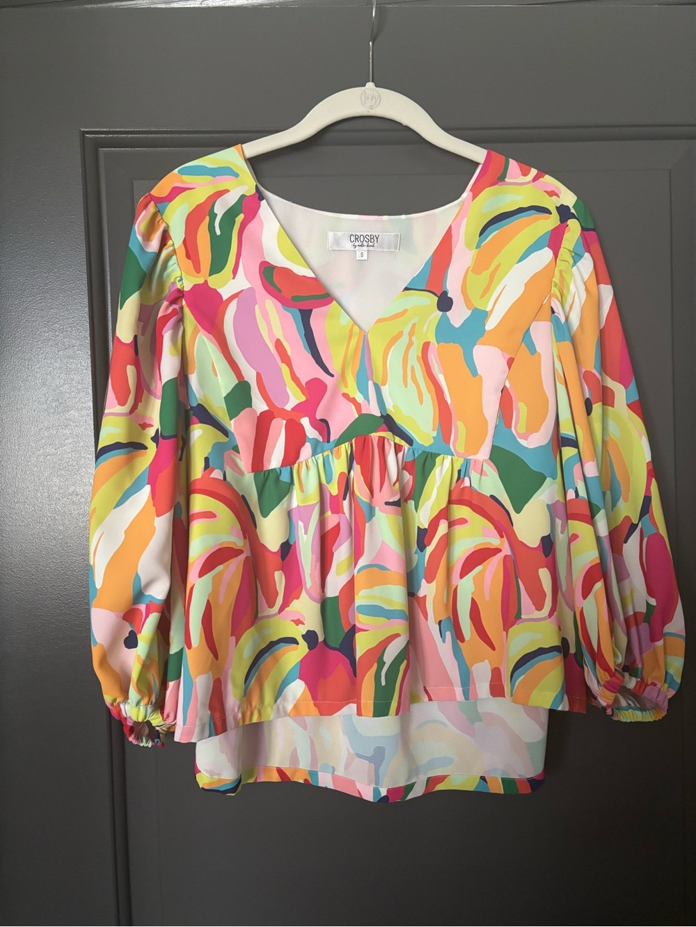 crosby. Bright Multicolor Abstract V-Neck Peplum Blouse